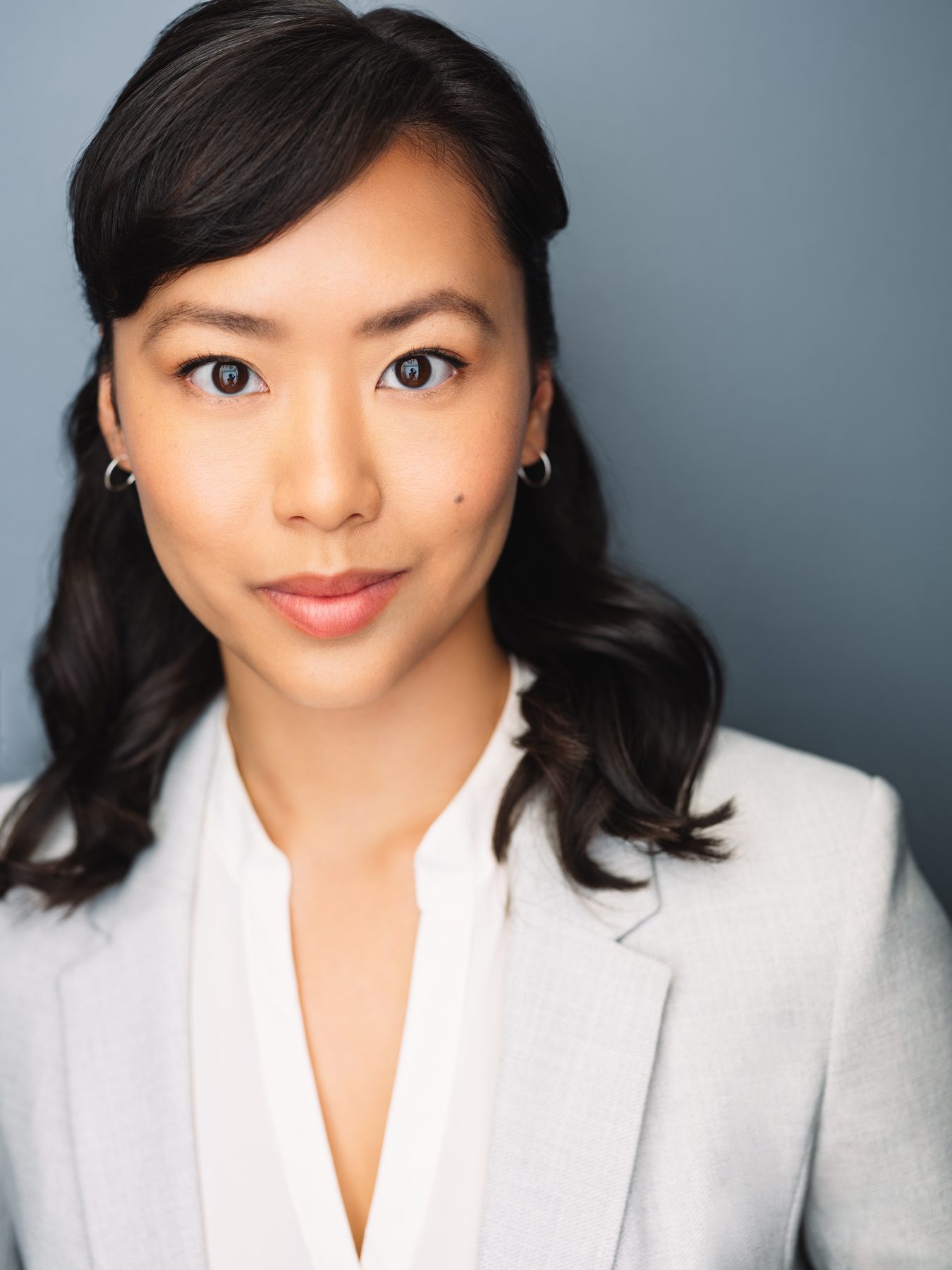 Ashley Chiu headshot — white blazer